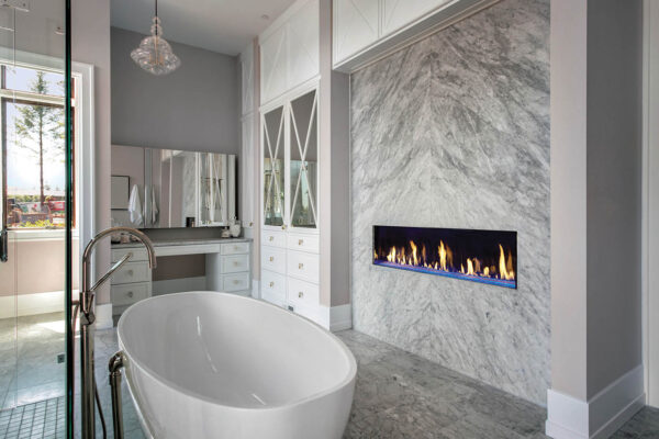 Luxurious Master Bathroom in New Home with Fireplace and Large B